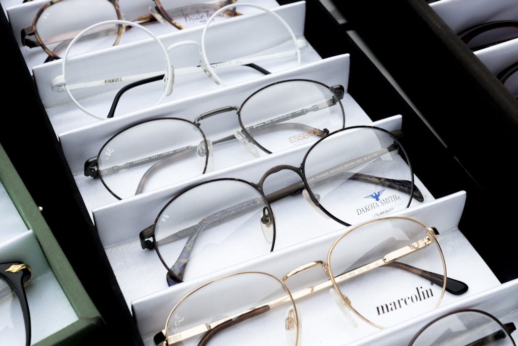 Close-up of assorted eyeglasses showcased in an orderly fashion for selection.